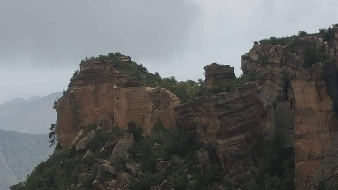 Dramatic cliff formations and layered rock structures